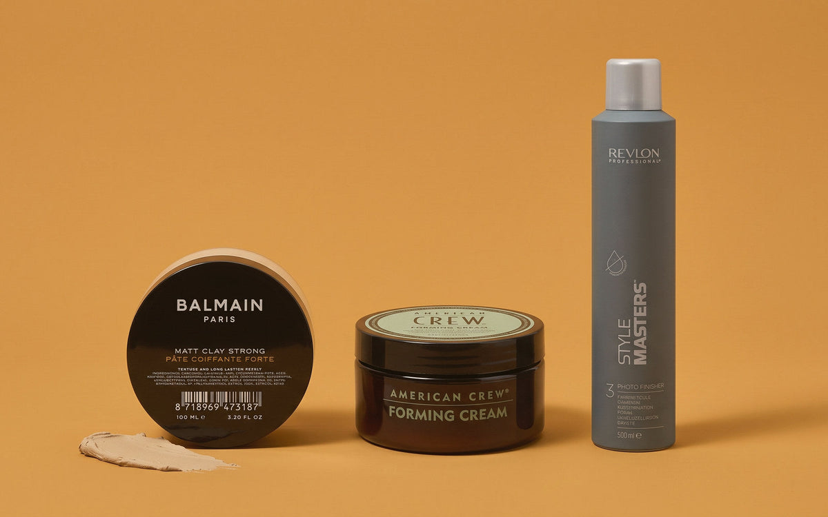 Balmain Matt Clay Strong, American Crew Forming Cream og Revlon Style Masters hårspray på okker baggrund